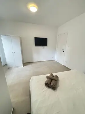 a bedroom with a teddy bear sitting on a bed at Luxury 2BR Apartment Heart of Mechelen in Mechelen