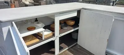 a kitchen island with a white counter top at Panorama Vue Penthouse in Brussels