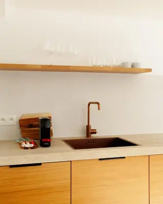a kitchen with a sink and a counter top at Cozy 1BDR Topfloor duplex flat in Antwerp