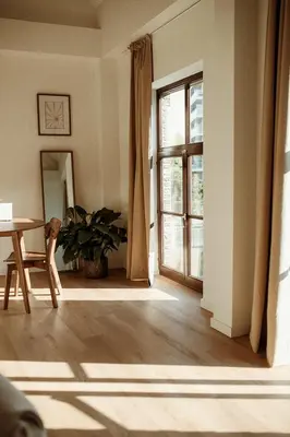 an empty living room with a table and a window at Studio & Stay Loft in Ghent