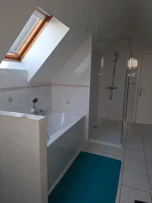a bathroom with a bath tub and a shower at Villa in Diest nabij het groen in Diest