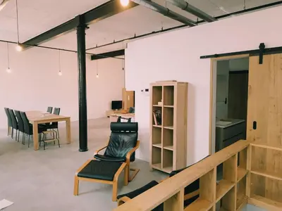 a room with a table and a chair and a desk at Boom Loft 9 in Boom
