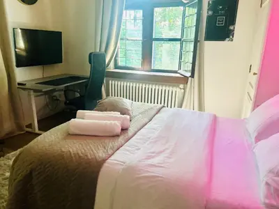 a bedroom with a bed with two towels on it at Luxury suite with a private terrace in Diest