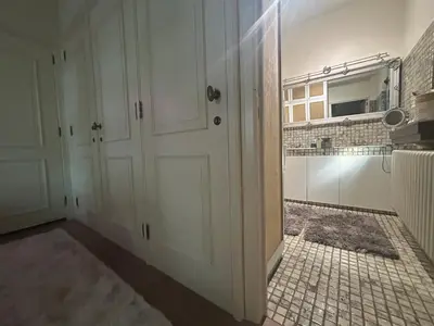 a room with a door and a tiled floor at Luxury suite with a private terrace in Diest