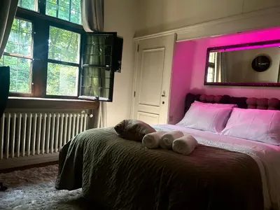 a bed with two teddy bears on top of it at Luxury suite with a private terrace in Diest