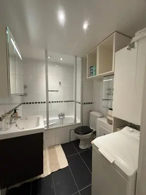 a bathroom with a sink and a toilet and a tub at Comfortable Apartment in Brussels, 35 m², 3 Persons in Brussels