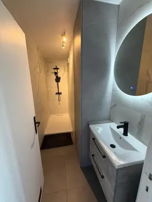 a small bathroom with a sink and a shower at TML 500m - Luxury Penthouse with 2 Balconies in Boom