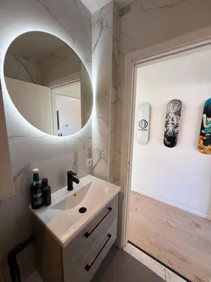 a bathroom with a sink and a mirror at TML 500m - Luxury Penthouse with 2 Balconies in Boom