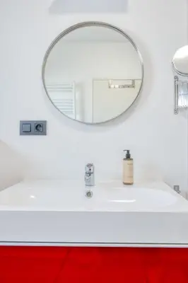 a bathroom with a white sink and a mirror at Charming & Central Stay with Terrace in Ghent