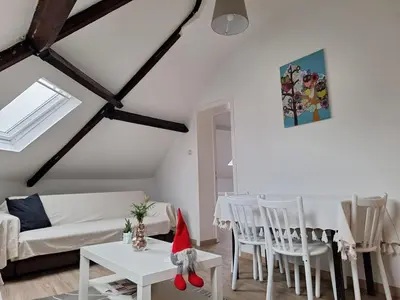 a living room with a santa hat sitting on a table at Cozy Nest by Gare du Midi in Brussels