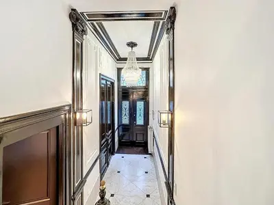 a hallway with a mirror on the wall and a hallway with a ceiling at JAMES AT20 - luxury downtown Antwerp villa in Antwerp