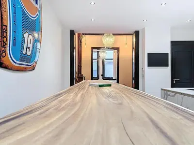 a bowling alley with a table in a room at JAMES AT20 - luxury downtown Antwerp villa in Antwerp