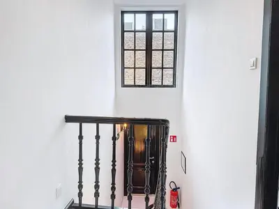a stairway with a window and a stair case at JAMES AT20 - luxury downtown Antwerp villa in Antwerp