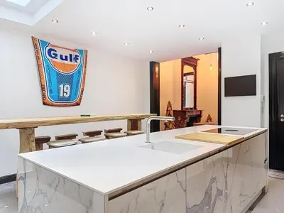 a kitchen with a sink and a counter top at JAMES AT20 - luxury downtown Antwerp villa in Antwerp