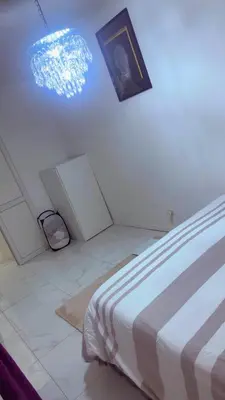 a bedroom with a bed and a picture on the wall at The Play Park Flat in Antwerp