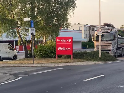 a red sign on the side of a street at Huis krekelhof in Antwerp