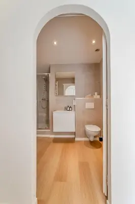 a bathroom with a toilet and a sink at Rooftop appartement in Sint-Niklaas
