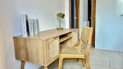 a wooden desk with a chair and a lamp at Apartment for 6 people - near Brussels & Airport in Wezembeek-Oppem
