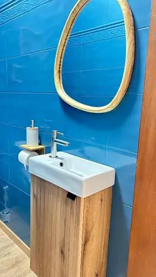 a bathroom with a sink and a mirror at Apartment for 6 people - near Brussels & Airport in Wezembeek-Oppem