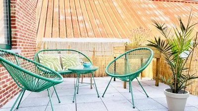 two green chairs and a table on a patio at Apartment for 6 people - near Brussels & Airport in Wezembeek-Oppem