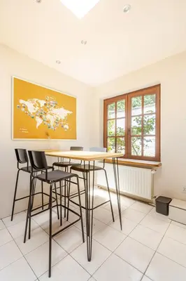 a dining room with a table and chairs at Maison du Cinquantenaire - The Residential in Brussels
