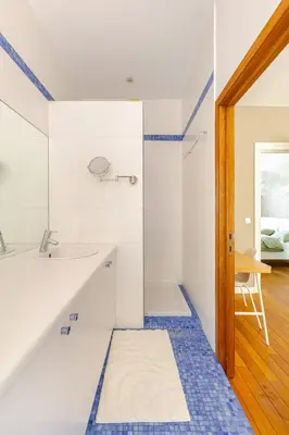a bathroom with a sink and a shower at Maison du Cinquantenaire - The Residential in Brussels