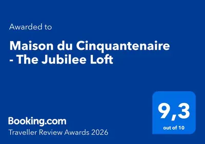 a blue sign with the text awaken to maison du cyrimaine at Maison du Cinquantenaire - The Jubilee Loft in Brussels