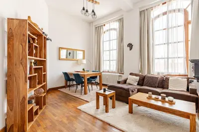 a living room with a couch and a table at Luxury home at Grand Place & Manneken Pis in Brussels