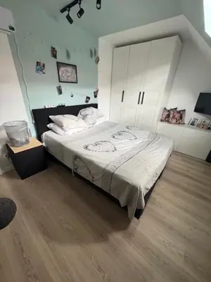 a bedroom with a large bed in a room at Radja in Boom