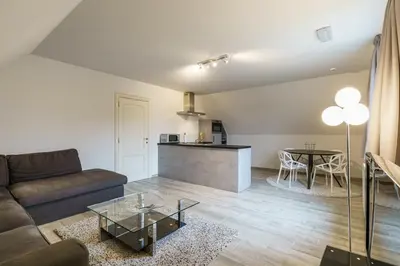 a living room with a couch and a table at Guesthouse De Meelberg in Beringen