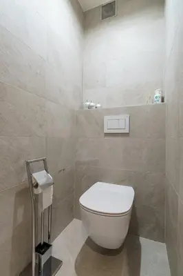 a bathroom with a white toilet in a room at Guesthouse De Meelberg in Beringen