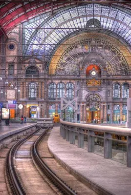 a train station with train tracks in it at Charming Private Studio - Nearby Antwerp Central Station in Antwerp