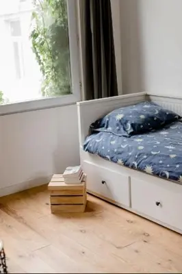 a bedroom with a bed and a window at Charming Private Studio - Nearby Antwerp Central Station in Antwerp