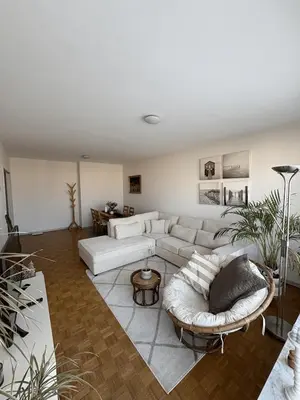 a living room with a couch and a table at Cosy apartment near Zaventem Airport in Brussels