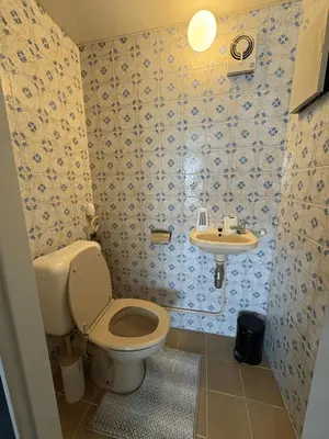 a bathroom with a toilet and a sink at Cosy apartment near Zaventem Airport in Brussels