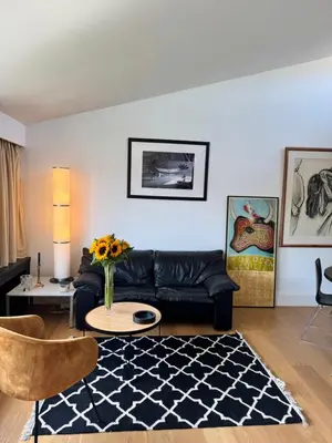 a living room with a couch and a table at Villa 'L' in Brussels