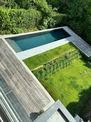 an overhead view of a swimming pool with grass at Villa 'L' in Brussels