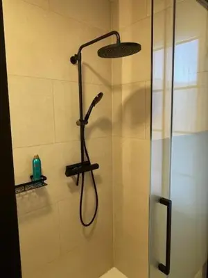 a shower with a shower head in a bathroom at Casa Duffla in Duffel