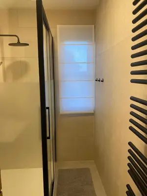 a bathroom with a shower with a glass door at Casa Duffla in Duffel