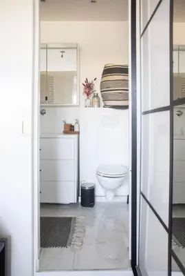 a bathroom with a toilet and a sink at Cozy apartment - Super central in Brussels