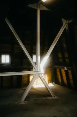 a light in the middle of a building at night at JAM Ghent in Ghent