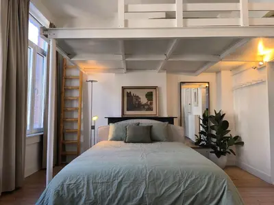 a bedroom with a bed in a room at Lovely City Centre Duplex in Antwerp