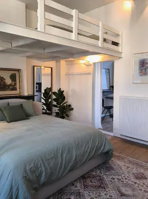 a bedroom with a bed with a loft at Lovely City Centre Duplex in Antwerp