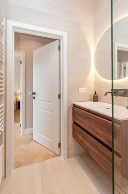 a bathroom with a sink and a mirror at Stylish Apartment in 't Zuid in Antwerp