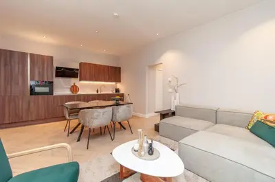a living room with a couch and a table at Stylish Apartment in 't Zuid in Antwerp