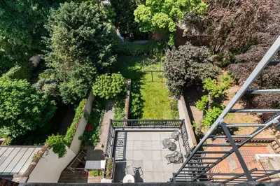 an overhead view of a garden with stairs and trees at Boutique Cogels Osy Suite Four Garden in Antwerp