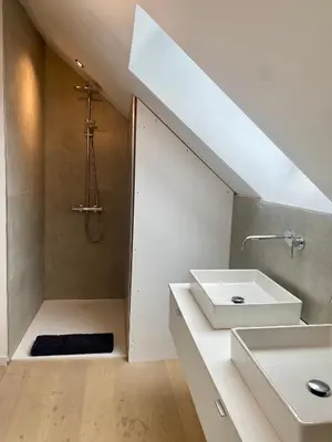 a bathroom with a sink and a shower at Hoeve DeKleinheide - De Hoeve in Dessel