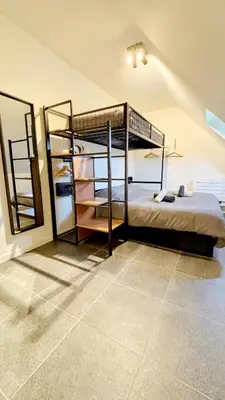 a bedroom with two bunk beds in a room at Bruggeske aan't bos in Mol