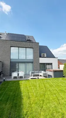 a house with a lawn in front of it at Bruggeske aan't bos in Mol