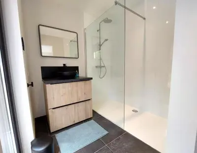 a bathroom with a sink and a shower at Vakantiewoning in 't groen-Lille in Lille